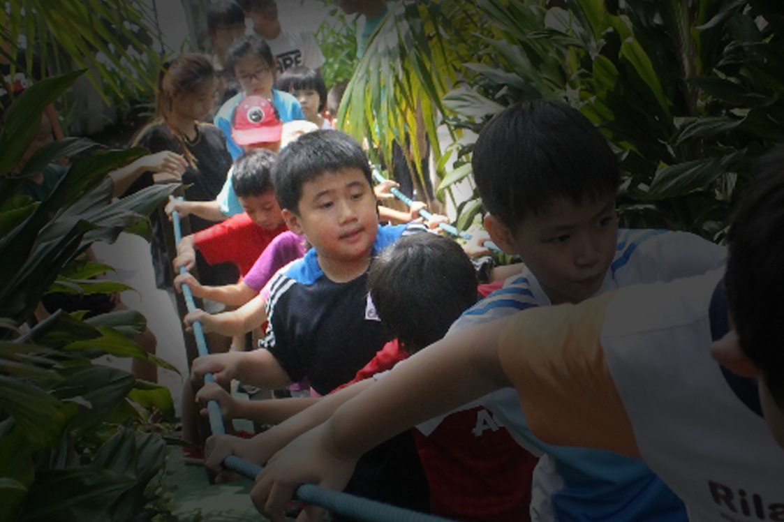 Hugh participating in team-building games during Sports and Fun Camp