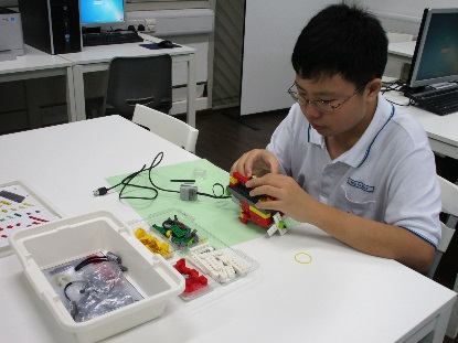 Fu Quan building his LEGO® structure