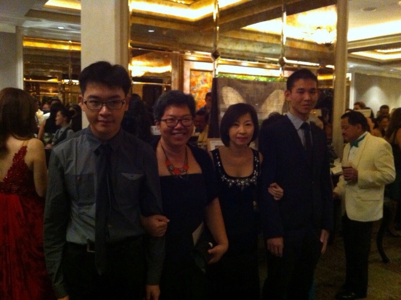Aaron James Yap (left) and Glenn Phua (right) with Ms Loy (second left) and Ms Kho (second right) at the Singapore Ireland Fund Ball