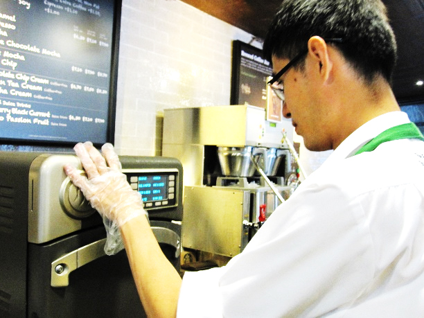 Lirui is happy in his job as a barista in Starbucks
