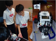 Tsui Kyit and his partner at their first Robotics competition