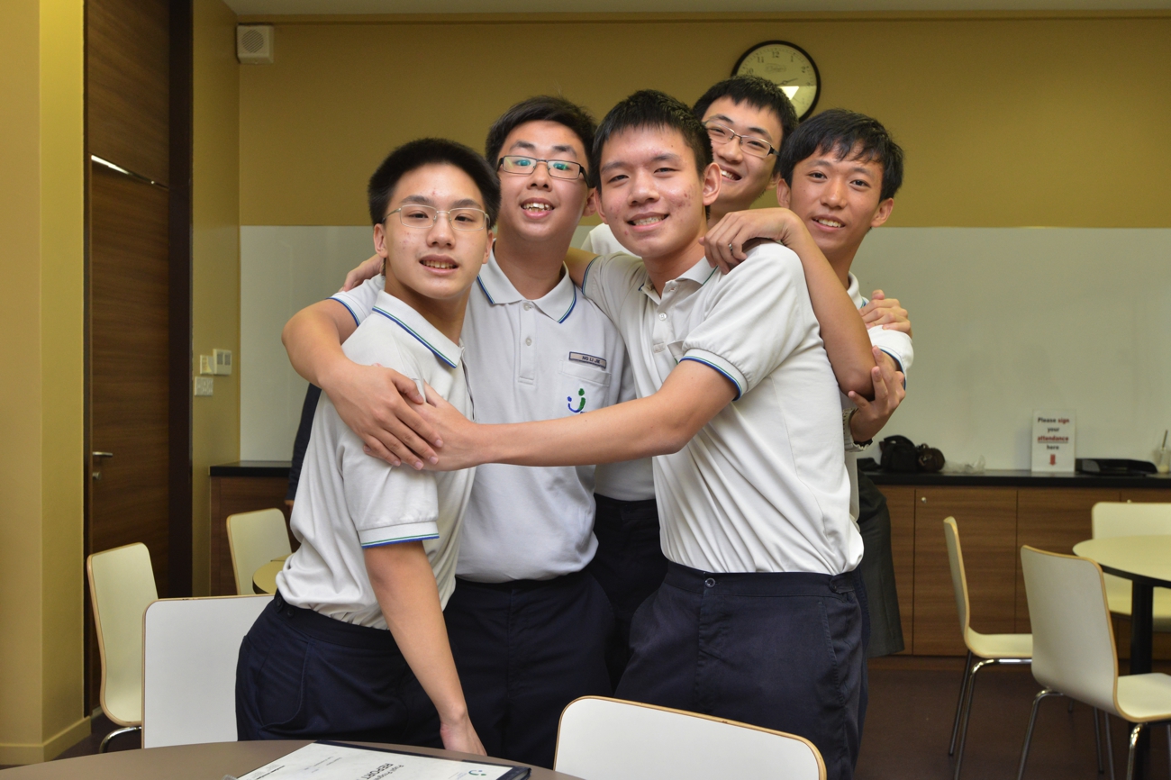 5 of the 6 students for a group hug